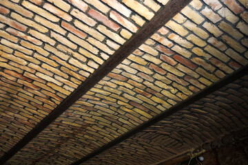 Close up vaulted brick ceiling in the old house. Major repairs