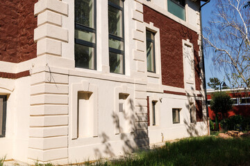 The side wall of an old mansion after major repairs