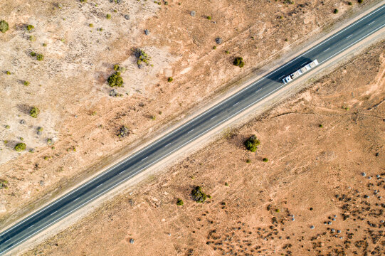 Aerial view of road train truck on Eyre Highway along the Nullarbor Plain