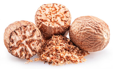 Nutmeg and ground nutmeg heap isolated on white background.