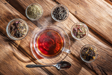 Cup of tea on wooden background. Top view.