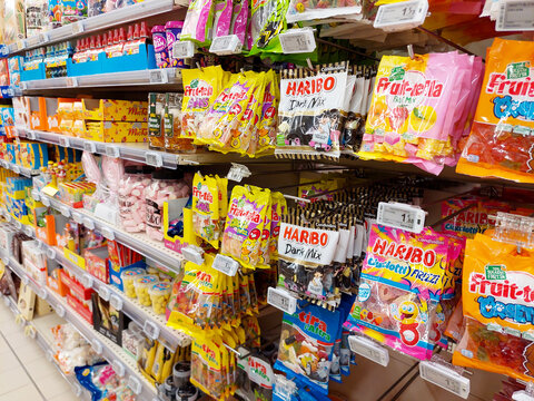 Italy &ndash; January 17, 2024: Bags of sweets Candies (Haribo and Fruittella) on a shelf in a supermarket