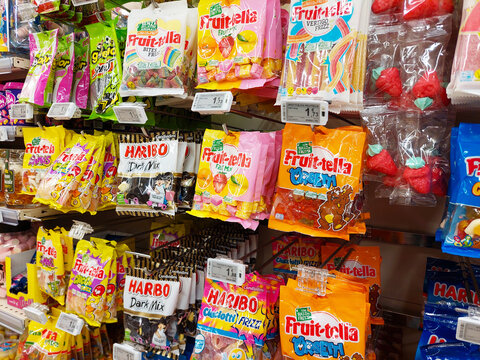 Italy &ndash; January 17, 2024: Bags of sweets Candies (Haribo and Fruittella) on a shelf in a supermarket