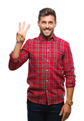 Naklejka premium Young handsome man over isolated background showing and pointing up with fingers number three while smiling confident and happy.