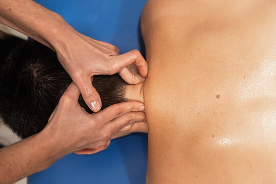 Close-up of a therapeutic shoulder massage treatment