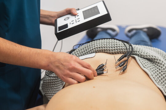 Electrotherapy Session with a Patient in Clinic