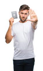 Young handsome man holding passport of united states over isolated background with open hand doing stop sign with serious and confident expression, defense gesture