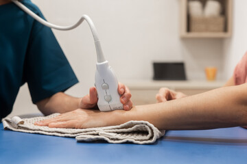 Ultrasound therapy procedure on a patient's arm