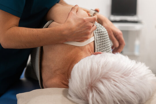 Nurse assisting elderly patient with healthcare needs
