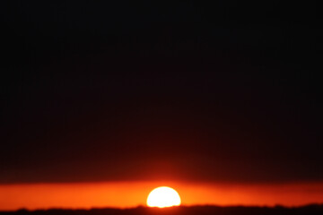 sunset on the horizon. sun rising on the horizon. arrival of night.