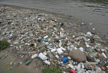 Polluted Indian River Overflowing with Debris and Trash