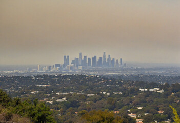 Poor air quality in Los Angeles due to nearby brush fire creating thick smog and haze, blocking...