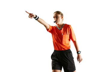 Precision in play. Accuracy of a young female referee on the field, blowing whistle and gesturing...