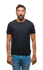 Fototapeta premium Adult hispanic man over isolated background afraid and shocked with surprise expression, fear and excited face.