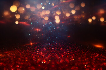 abstract glitter black, red, gold , blue lights background. de-focused