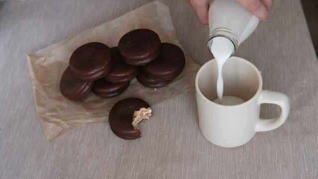Choco Pie Chocolate Coated Snacks And Bottle Of Milk On Wooden Background