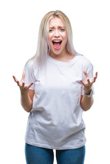 Young blonde woman over isolated background crazy and mad shouting and yelling with aggressive expression and arms raised. Frustration concept.