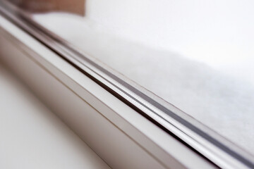 Windows Triple Glazed pvc Profile Window with Snow in Winter Close up. Warm Low-Energy Home in...