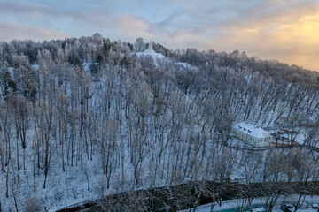 Aerial beautiful winter snowy sunrise view of Vilnius old town, Three Crosses Monument (Trys kryžiai), Lithuania