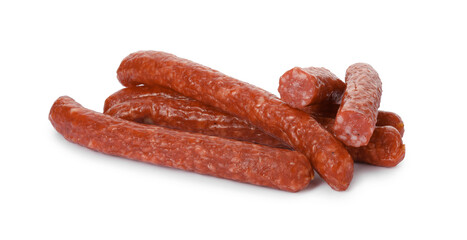 Many thin dry smoked sausages isolated on white