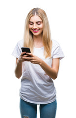 Fototapeta premium Young beautiful blonde woman using smartphone over isolated background with a happy face standing and smiling with a confident smile showing teeth