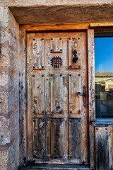 Rural wooden door in the medieval village of Maderuelo.Segovia. Spain. Europe.