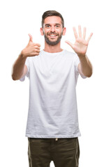 Young handsome man over isolated background showing and pointing up with fingers number six while smiling confident and happy.