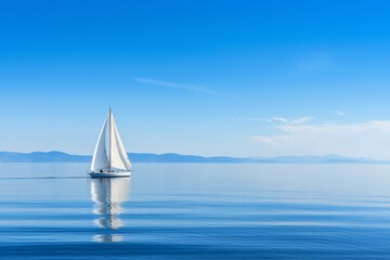 Obraz premium A sailboat gliding on calm waters, the sail reflecting the pure blue of the sky, Generative AI