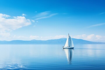 Fototapeta premium A sailboat gliding on calm waters, the sail reflecting the pure blue of the sky, Generative AI