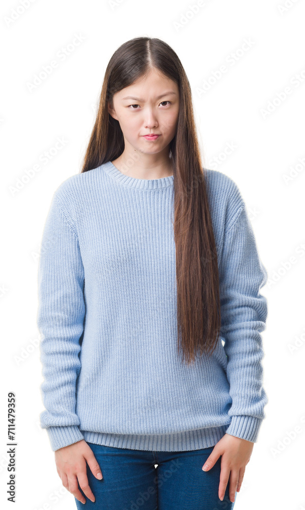 Canvas Prints Young Chinese woman over isolated background skeptic and nervous, frowning upset because of problem. Negative person.