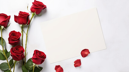 Blank paper card and red rose flowers background. Holiday Valentine or wedding greetings