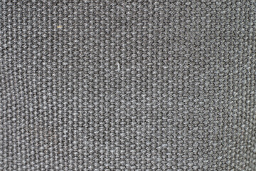 Gray woven or knit fabric texture surface. Top view, macro shot, no people