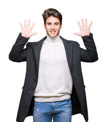 Fototapeta premium Young elegant man wearing winter coat over isolated background showing and pointing up with fingers number ten while smiling confident and happy.