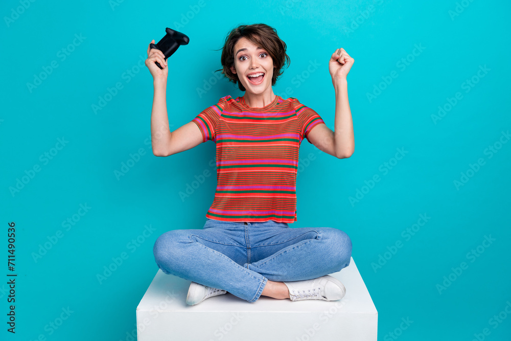 Sticker Photo of overjoyed positive glad girl wear trendy clothes scream hooray yeah victory isolated on cyan color background