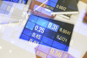 Double exposure of abstract creative statistics data hologram and modern digital tablet on background, analytics and forecasting concept