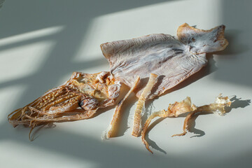 One dried squid on a white background