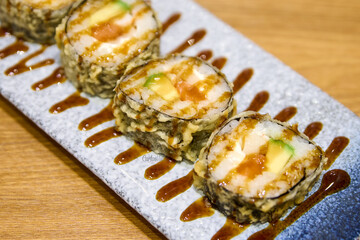 Japanese cuisine. closeup of sushi rolls on a plate