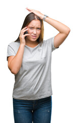 Fototapeta premium Young beautiful caucasian woman talking on smartphone over isolated background stressed with hand on head, shocked with shame and surprise face, angry and frustrated. Fear and upset for mistake.