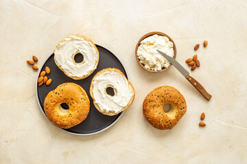 Fresh bagels with cheese cream. Homemade bread background
