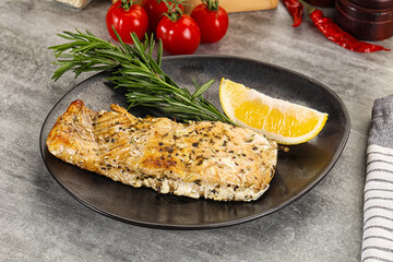 Baked salmon fish served rosemary