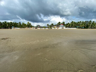 Long span of broad gently sloping strip of fine sand beach lures resort developers to put up...
