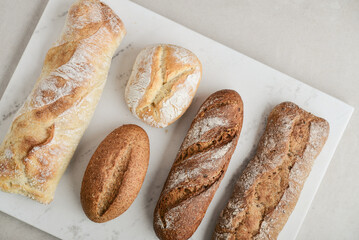 Assorted bakery products including loafs of bread