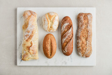 Assorted bakery products including loafs of bread