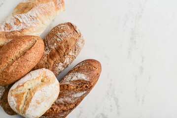 Assorted bakery products including loafs of bread