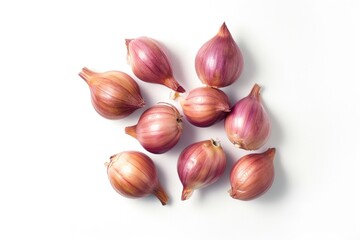 A group of onions on a white surface.