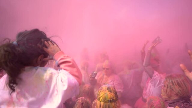 People celebrating holi festival with colors. Holi is a festival of India. 
