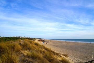 Playa de la Barrosa beach and dunes at the Atlantic Ocean near Novo Sancti Petri, Costa de la Luz,...
