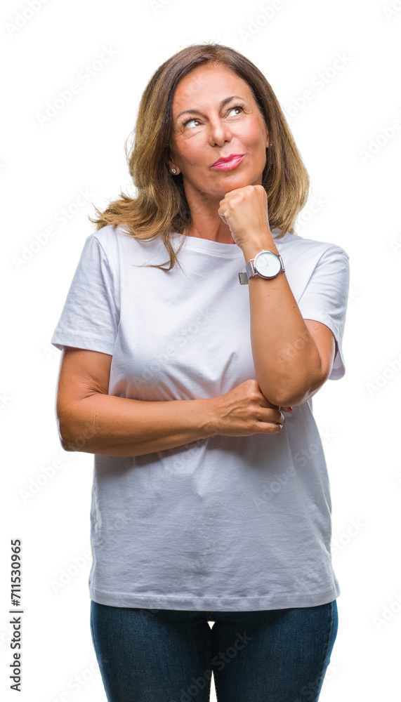 Canvas Prints Middle age senior hispanic woman over isolated background with hand on chin thinking about question, pensive expression. Smiling with thoughtful face. Doubt concept.