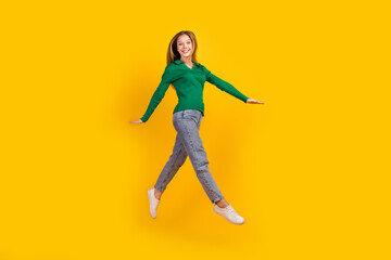 Fototapeta na wymiar Full body size photo of jumping carefree young girl teenager running into bright future happiness isolated on yellow color background