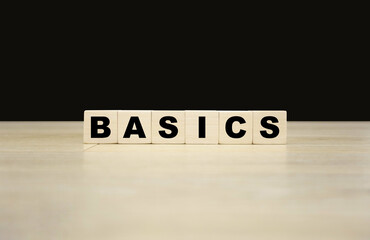 Basics word written on wooden blocks. Basics text for your desing, concept.